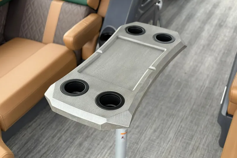 Slide: The Image of Bennington 22 M Quad Bench 2027 interior with cup holders and seating. - 5