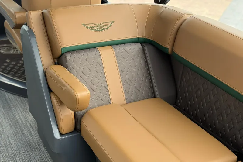 Slide: The Image of Luxurious seating in the 2027 Bennington 22 M Quad Bench boat, featuring premium upholstery. - 19