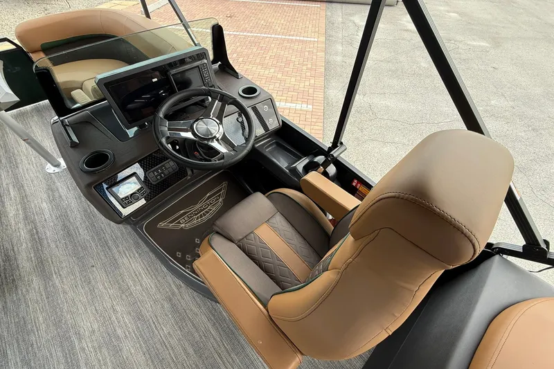 Slide: The Image of Interior of 2027 Bennington 22 M Quad Bench boat with steering wheel and dashboard. - 13