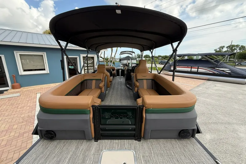 Slide: The Image of 2027 Bennington 22 M Quad Bench pontoon boat with spacious seating and canopy. - 20