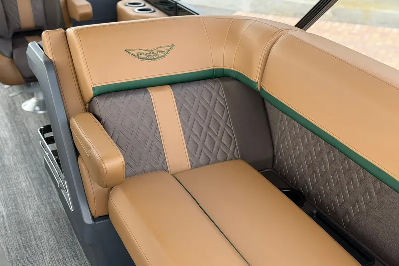 Slide: The Image of Luxurious seating in 2027 Bennington 22 M Quad Bench boat, featuring tan and gray upholstery. - 3