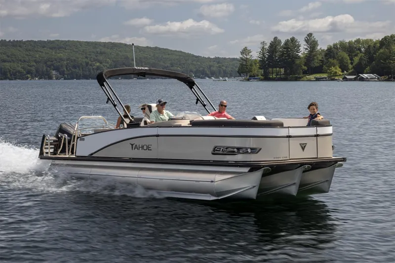 The Image of Manufacturer Provided Image: 2025 Tahoe Pontoon Cascade Cruise Rear Bench on a scenic lake. - 0