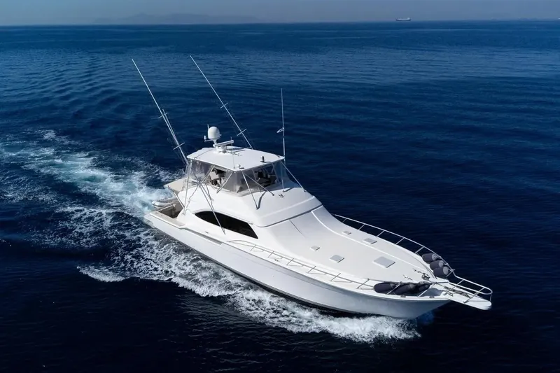 The Image of Luxury 2008 Bertram 670 yacht cruising on open sea, aerial view. - 0