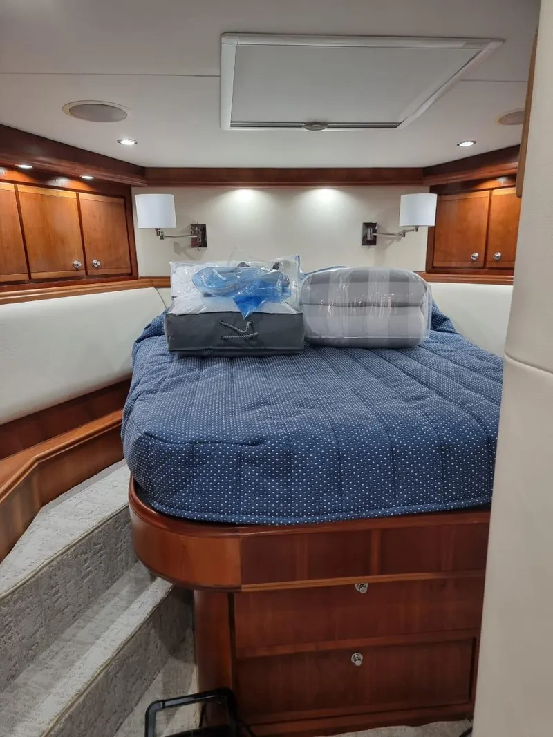 Slide: The Image of Luxurious bedroom interior of a 2008 Bertram 670 Convertible yacht. - 23