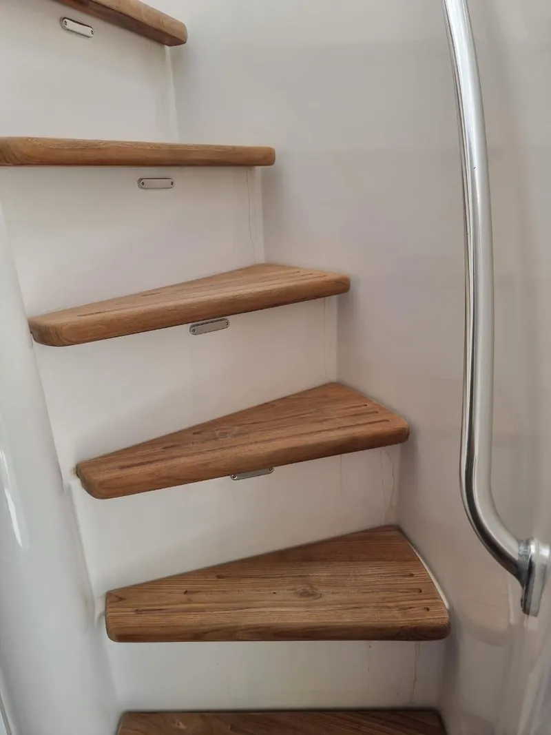 Slide: The Image of Wooden steps on a 2008 Bertram 670 Convertible yacht. - 14
