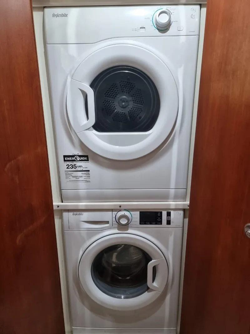 Slide: The Image of Stacked washer and dryer in a 2008 Bertram 670 Convertible boat. - 26