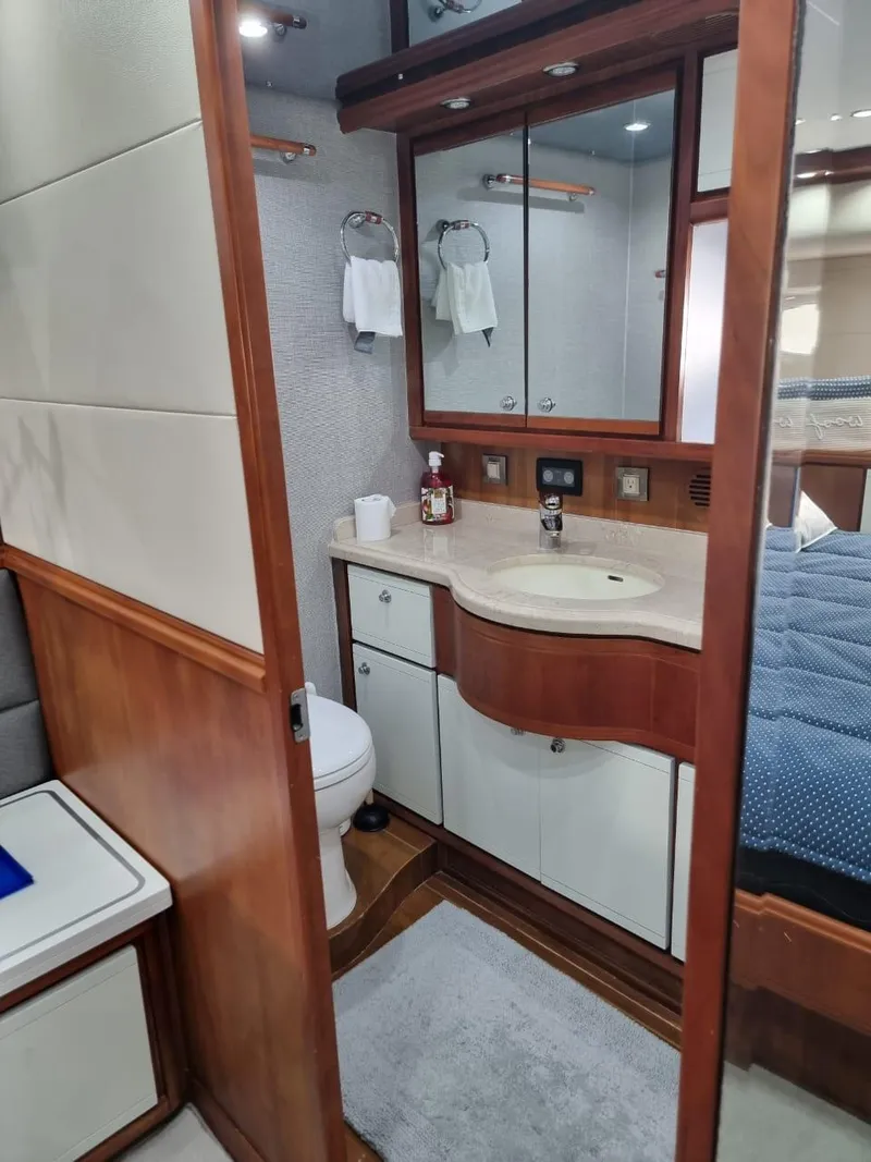 Slide: The Image of Luxurious bathroom in a 2008 Bertram 670 Convertible yacht with modern fixtures. - 28