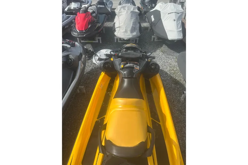 Slide: The Image of 2022 Sea-Doo GTR 230 in yellow, parked among other jet skis. - 8