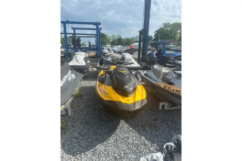 Slide: The Image of 2022 Sea-Doo GTR 230 jet ski in a storage yard, surrounded by other watercraft. - 4