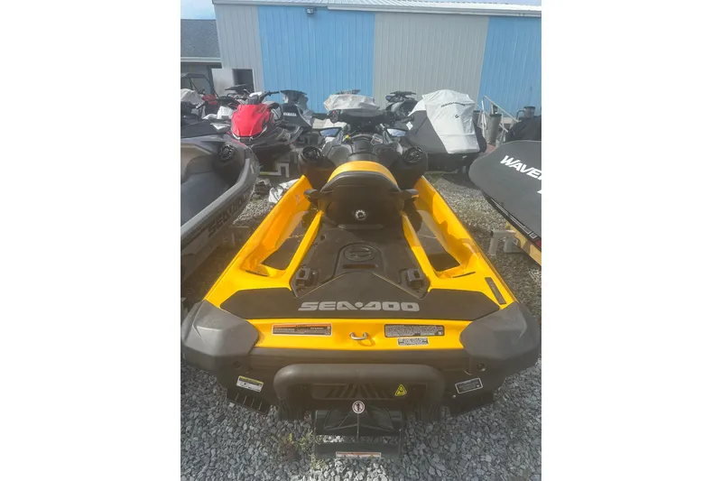 Slide: The Image of 2022 Sea-Doo GTR 230 jet ski in a storage area, vibrant yellow color. - 9