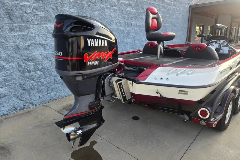 Slide: The Image of 2007 Ranger Z21 boat with Yamaha VMAX 250 HPDI outboard motor, parked on concrete. - 2
