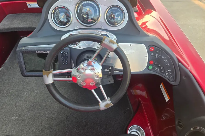 Slide: The Image of Dashboard of a 2007 Ranger Z21 boat with steering wheel and gauges. - 5