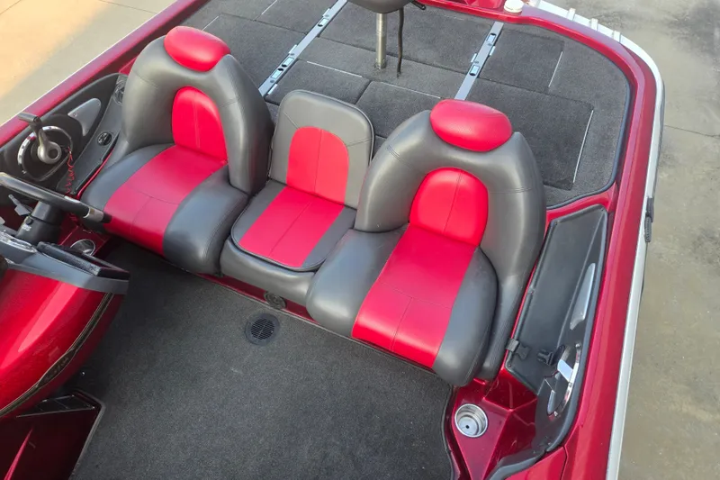 Slide: The Image of Red and gray interior of a 2007 Ranger Z21 boat with dual seats. - 11