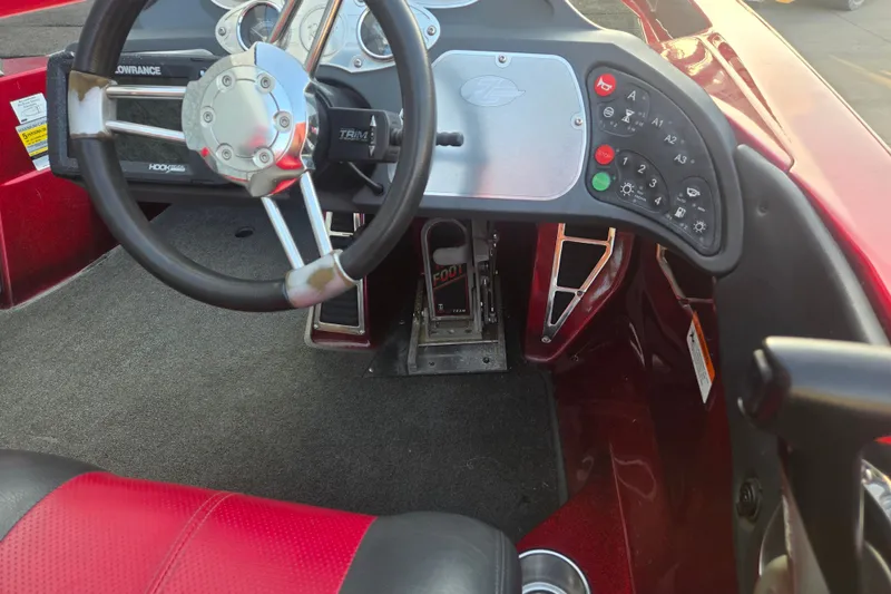 Slide: The Image of 2007 Ranger Z21 boat cockpit with steering wheel and control panel. - 15