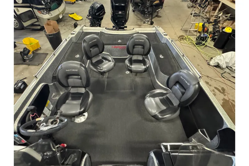 Slide: The Image of 2015 Nitro ZV21 boat interior with four seats in a workshop setting. - 23
