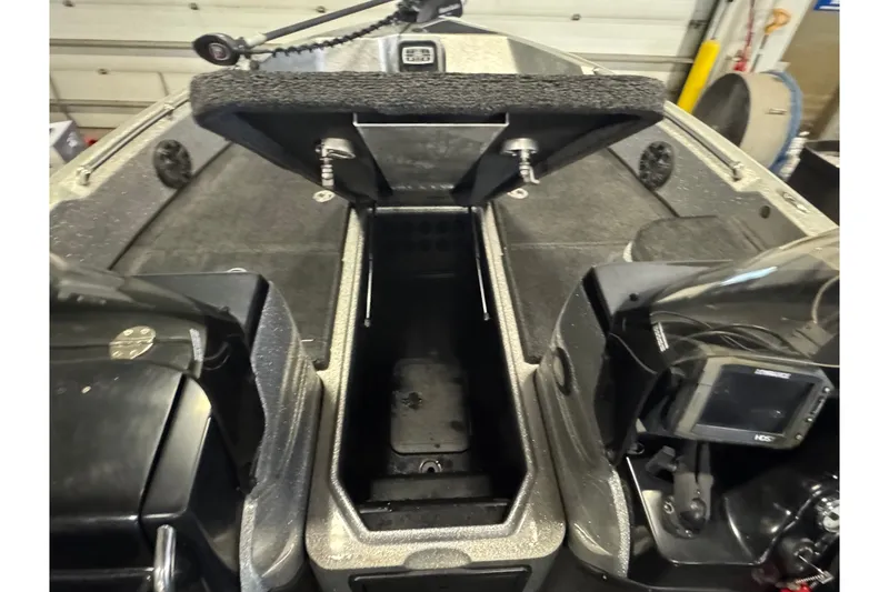 Slide: The Image of 2015 Nitro ZV21 boat interior with storage compartment and control panel. - 18