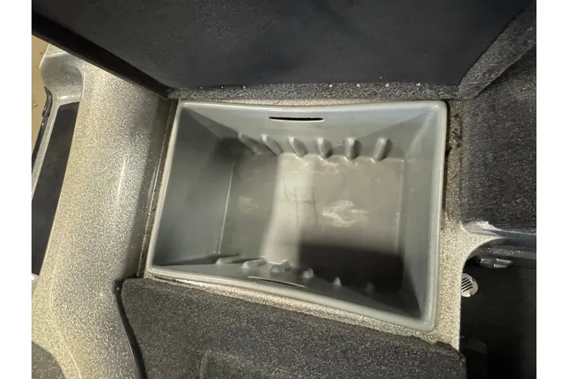 Slide: The Image of Storage compartment in a 2015 Nitro ZV21 boat, featuring a spacious interior. - 16