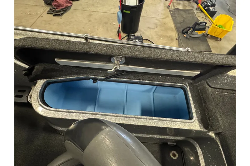 Slide: The Image of Open storage compartment in a 2015 Nitro ZV21 boat, showcasing interior space. - 14