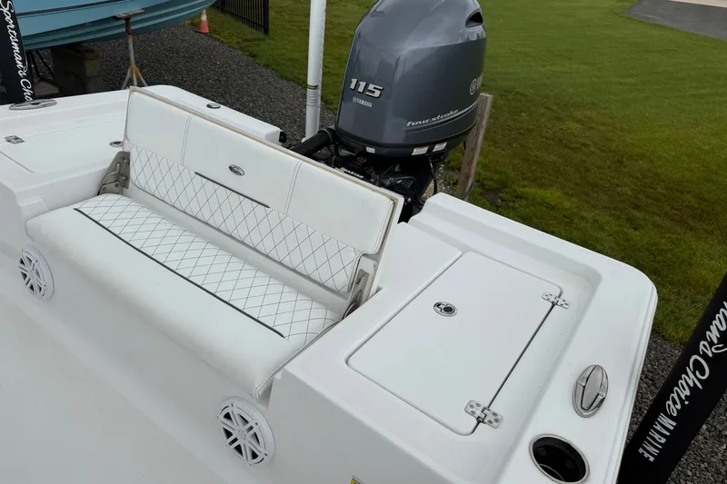 Slide: The Image of 2022 Sportsman Masters 207 Bay Boat with Yamaha 115 engine and cushioned seating. - 15