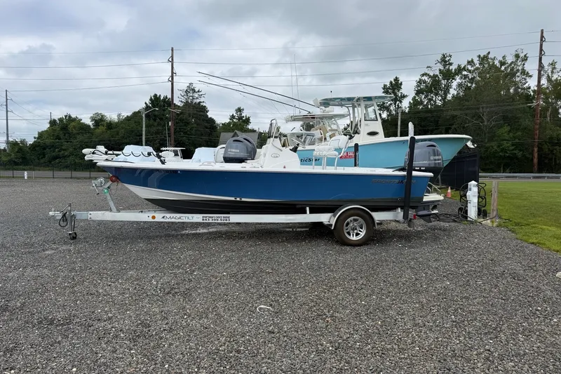 The Image of 2022 Sportsman Masters 207 Bay Boat on trailer in outdoor setting. - 0