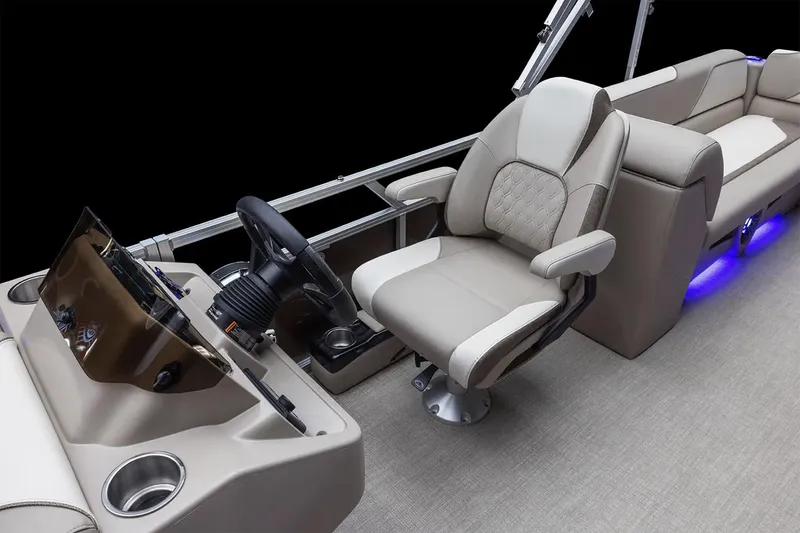 Slide: The Image of Manufacturer Provided Image: Manufacturer Provided Image: 2025 Tahoe Pontoon Sport Quad Lounger interior with captain's chair and dashboard. - 3
