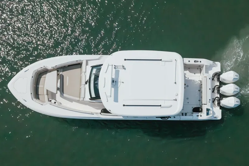 Slide: The Image of Top view of 2023 Boston Whaler 350 Realm boat on water. - 2