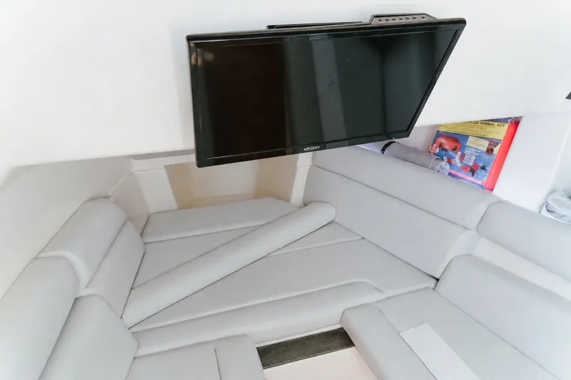 Slide: The Image of Interior of 2023 Boston Whaler 350 Realm with TV and comfortable seating. - 16