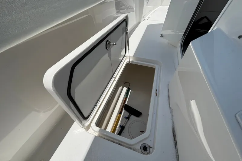 Slide: The Image of Open storage compartment on 2024 Invincible 33 Catamaran boat deck. - 29