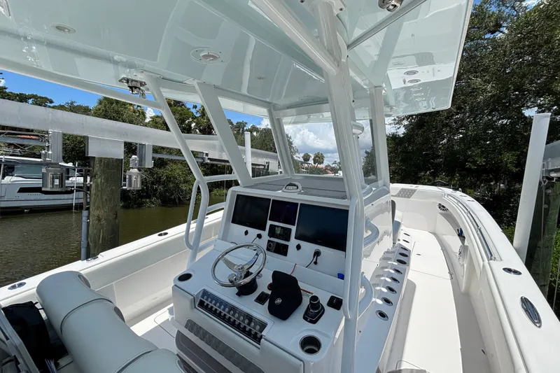 Slide: The Image of 2024 Invincible 33 Catamaran cockpit with modern controls and sleek design. - 3