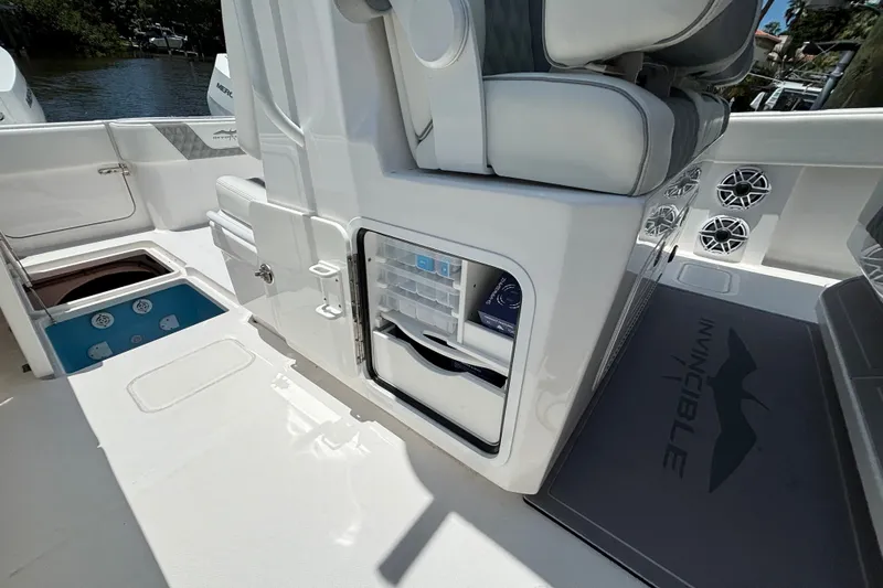 Slide: The Image of 2024 Invincible 33 Catamaran interior with storage compartments and seating. - 46