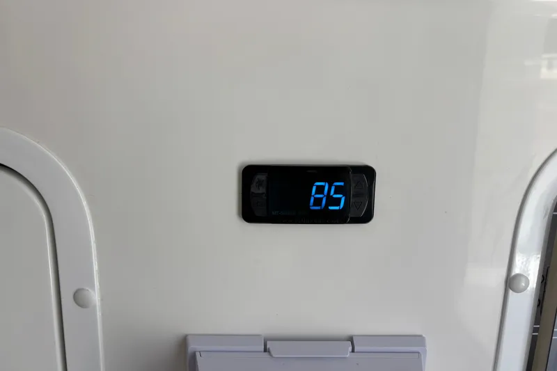 Slide: The Image of Digital display showing "85" on 2024 Invincible 33 Catamaran interior panel. - 4