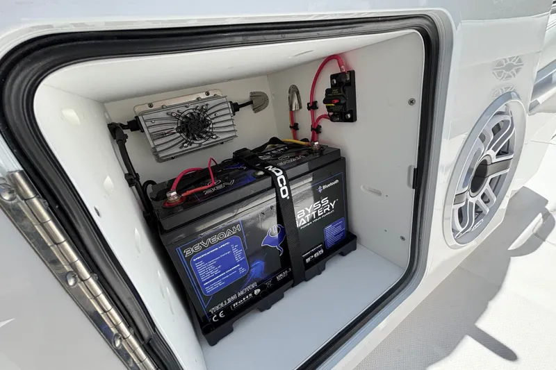 Slide: The Image of Battery compartment of 2024 Invincible 33 Catamaran, featuring advanced marine battery setup. - 37