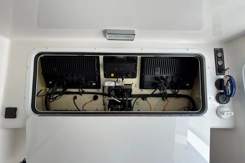 Slide: The Image of Electrical panel of 2024 Invincible 33 Catamaran with wiring and components visible. - 6
