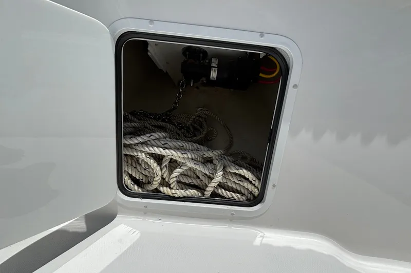 Slide: The Image of Storage compartment with rope on a 2024 Invincible 33 Catamaran. - 23