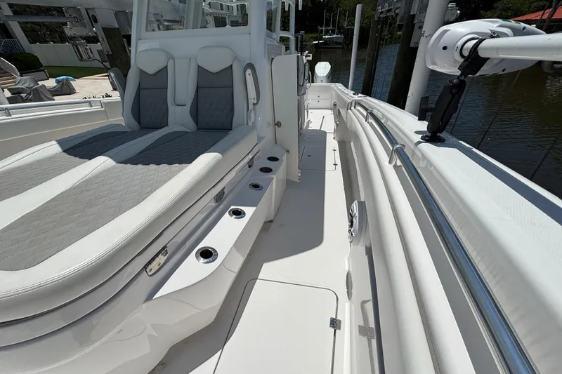 Slide: The Image of 2024 Invincible 33 Catamaran interior with sleek seating and modern design. - 21