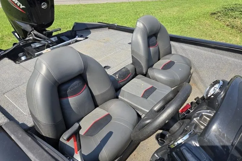 Slide: The Image of 2024 Tracker Pro Team 175 TXW boat interior with gray and red seats. - 14