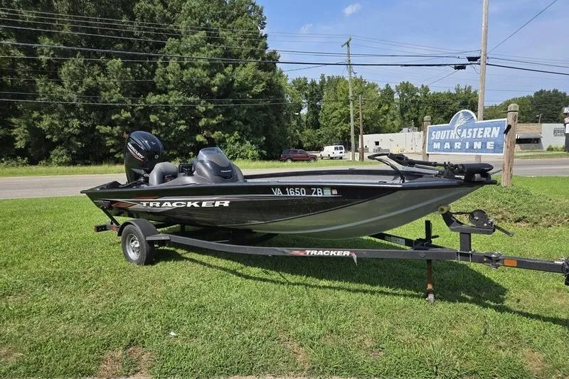 The Image of 2024 Tracker Pro Team 175 TXW boat on trailer, parked on grass near Southeastern Marine. - 1