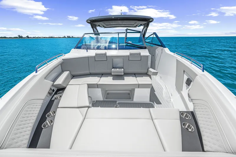 Slide: The Image of The image shows the spacious cockpit of a 2027 Cruisers Yachts 34 GLS OB with gray upholstery. - 36
