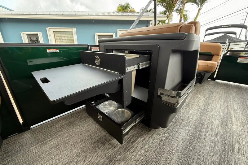 Slide: The Image of 2027 Bennington 24 M Fish and Cruise boat interior with storage compartments open. - 7