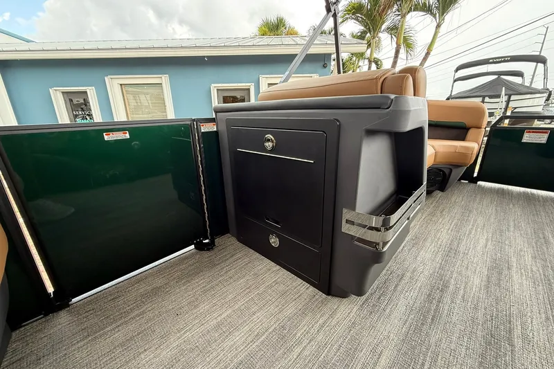 Slide: The Image of 2027 Bennington 24 M Fish and Cruise interior with seating and storage. - 6