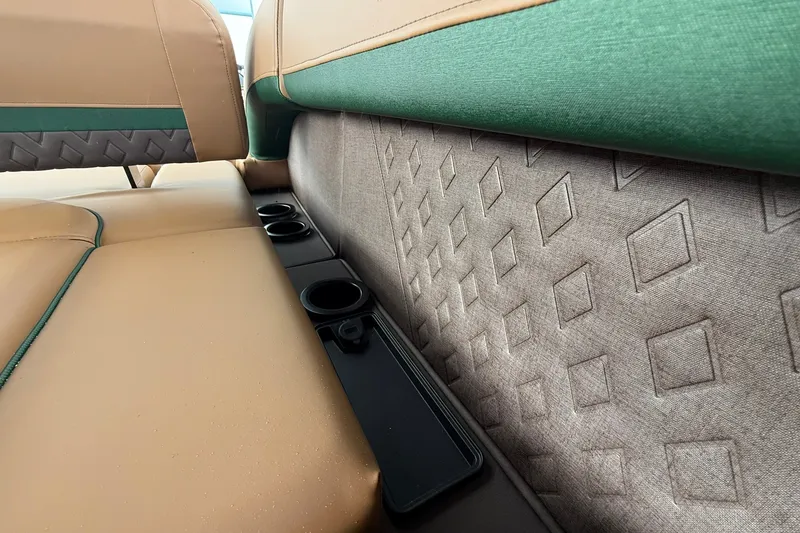 Slide: The Image of Interior seating with cup holders on a 2027 Bennington 24 M Fish and Cruise boat. - 14