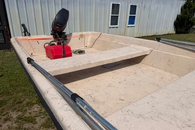 Slide: The Image of 2003 Southern Skimmer 14 SKIFF boat with outboard motor and red fuel tank. - 4