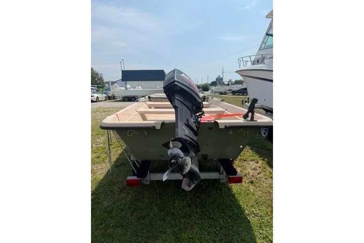 Slide: The Image of 2003 Southern Skimmer 14 Skiff boat with outboard motor on trailer. - 7