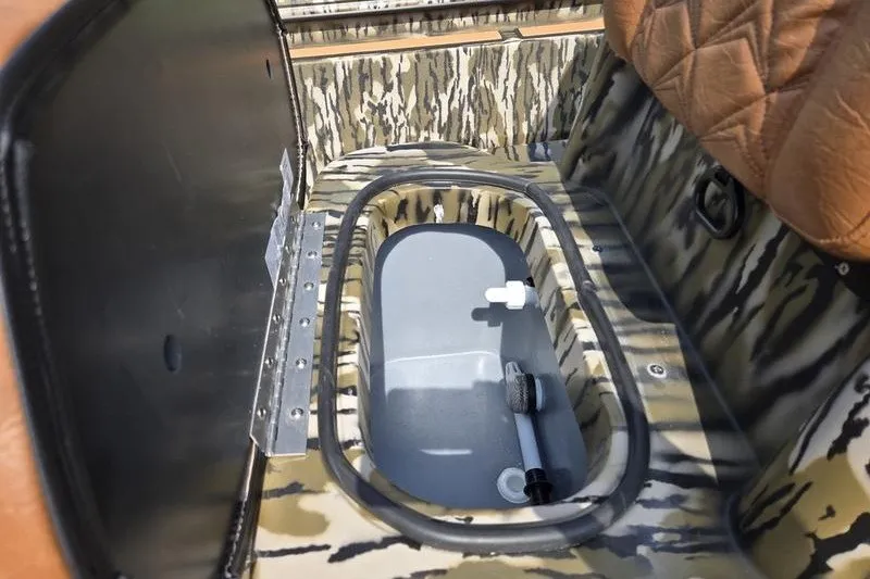 Slide: The Image of Camouflage interior of 2027 Avid 20 Rogue CC boat with storage compartment. - 7