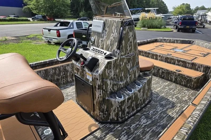 Slide: The Image of Camouflage-patterned Avid 20 Rogue CC boat interior with Garmin navigation system, 2027 model. - 3
