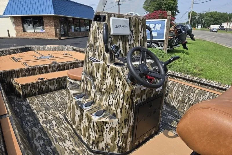 Slide: The Image of Camouflage-patterned Avid 20 Rogue CC boat interior with Garmin navigation system, 2027 model. - 12