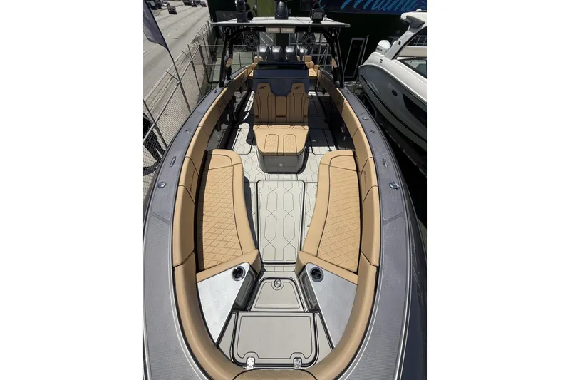 Slide: The Image of 2007 Midnight Express 37 Open boat with tan seating and sleek design. - 24