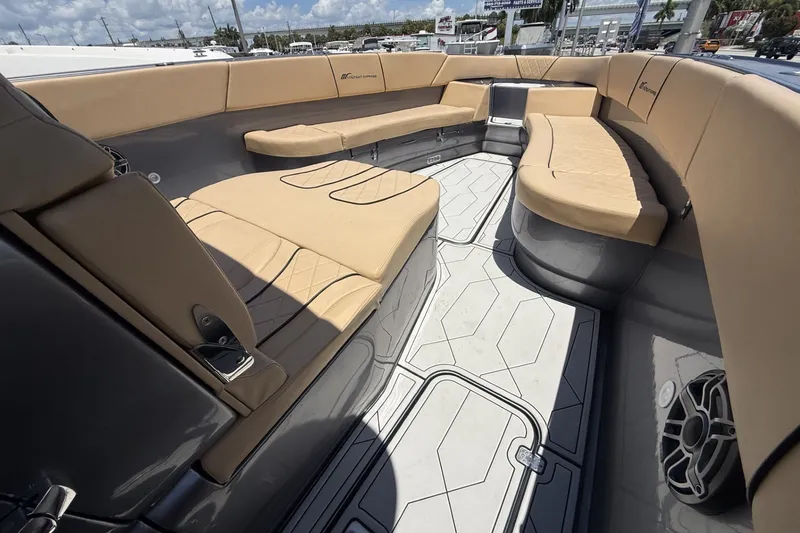 Slide: The Image of Luxurious seating area on a 2007 Midnight Express 37 Open boat with beige cushions. - 22