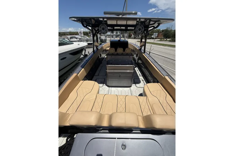 Slide: The Image of 2007 Midnight Express 37 Open boat with tan seating and spacious deck layout. - 21