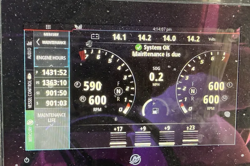 Slide: The Image of Dashboard of a 2007 Midnight Express 37 Open boat showing engine hours and maintenance alert. - 18